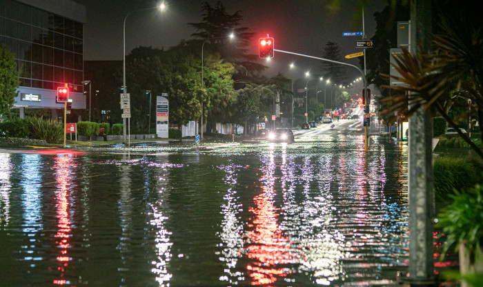Night time street scene of a flooded Auckland street